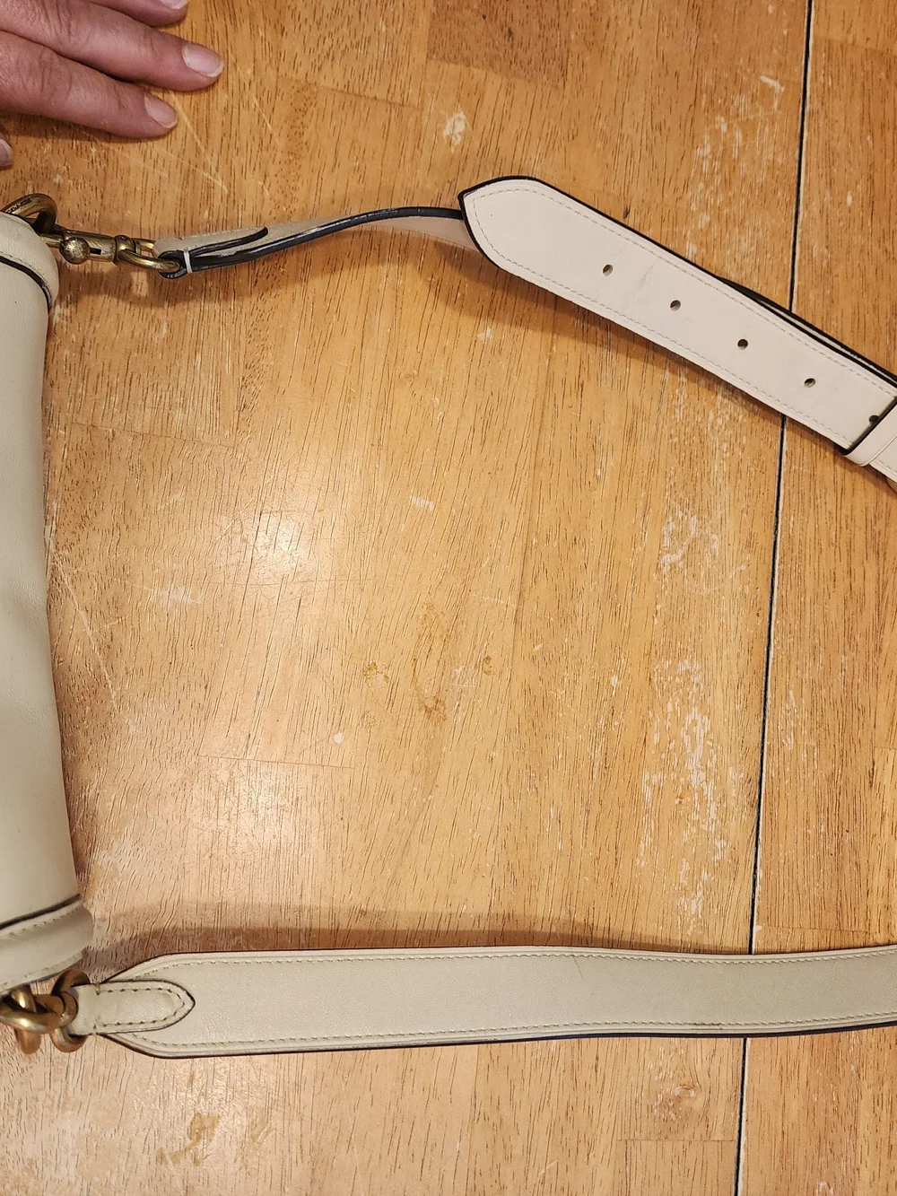 2021 Ivory Coach Beat saddle bag is crafted from glovetanned leather and brass